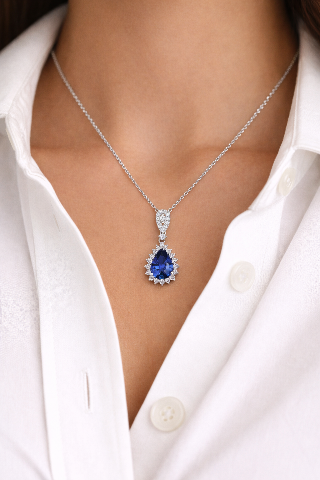 18K White Gold Pear Shape Sapphire And Diamond Halo Pendant