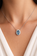 White Gold Oval Blue Topaz and Diamond Halo Necklace
