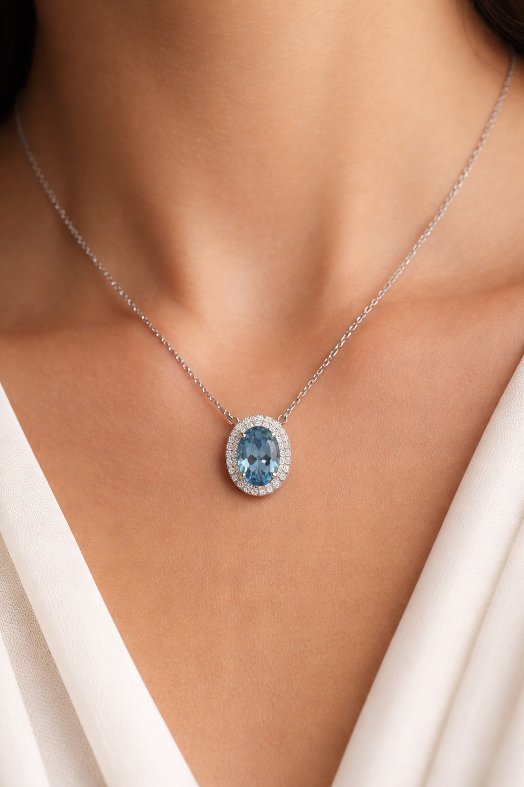White Gold Oval Blue Topaz and Diamond Halo Necklace